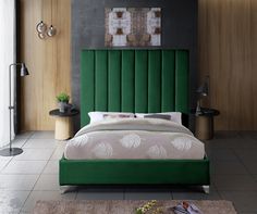 a bedroom with a green headboard and white bedding