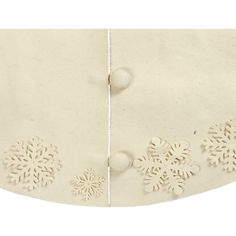 a white jacket with snowflakes on it