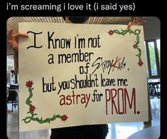 a person holding up a sign that says i'm screaming love it said yes