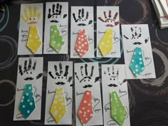 six handprinted cards with different colors and designs on them, each featuring a man's tie