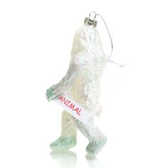 a glass ornament with an animal on it's body and name tag