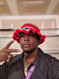 Igbo Warrior Cap As seen on popular artist OdumoduBlvck.  This fashionable Igbo warrior crochet hat is styled after a traditional Igbo hat called the OKPU-AGU.  The OKPU AGU which translates to "leopard hat" is a sign of bravery and was historically worn by Igbo warriors and Igbo Chiefs. The woven Red, Black, and White pattern is an abstract depiction of leopard stripes. The bucket hat style is Igbo culture with a fashionable modern twist. This hat is handmade by specialized crochet artist in Ni Adjustable Hip Hop Beanie Hat, Red One Size Bucket Hat, Red Bucket Hat For Festivals, Red Crochet Bucket Hat For Winter, Red Bohemian Crochet Bucket Hat, Red Wide Brim Crochet Hat, Red Crochet Wide Brim Hat, Red Bucket Hat For Streetwear, Red Yarn Hat With Curved Brim