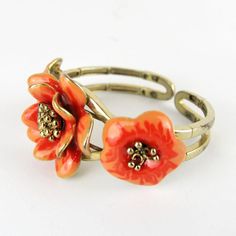 Gorgeous vintage articulated bracelet with enameled flower.       Condition:  Very good preowned condition.  Creator: -  Materials and Techniques:  metal, enamel  Marks:    Date (~):  1960s  Place of Origin:  France  Measurements: Diameter interior 5,5 cm, middle flower 3,5 cm  Weight: circa 70 gr Adjustable Metal Flower Ring, Adjustable Flower Shaped Metal Ring, Unique Enamel Flower Shaped Jewelry, Unique Enamel Flower Jewelry, Vintage Orange Flower Jewelry, Orange Vintage Flower Jewelry, Vintage Enamel Flower Ring For Gift, Vintage Bracelet Jewelry For Spring, Adjustable Vintage Enamel Bracelets