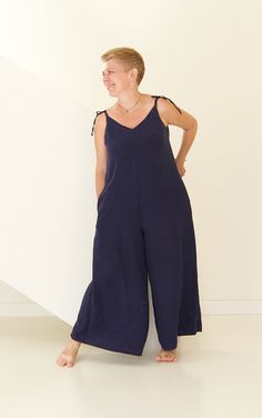 "This loose jumpsuit is the most comfy outfit you have worn ever! Flattering and flowy cut fits pretty much any size. Natural linen is a cool wear on a warm summer day. Choose from 30 colors palette to have outfit for particular occasion. For example - light or bright color for tropical vacation, neutral - as loungewear, dark-rich - for cozy dinner out or city strolling. Just switch on your imagination! If you want this jumpsuit in our exclusive linen colors, please follow this link: https://www Relaxed Fit Linen Jumpsuit With V-neck, Linen Jumpsuits And Rompers For Loungewear, Linen Jumpsuits And Rompers With Pockets, Wide Leg Linen Jumpsuits And Rompers, Linen Wide Leg Jumpsuits For Beach, Linen Wide-leg Jumpsuits For Beach, Beach Linen Wide Leg Jumpsuits And Rompers, Wide Leg Linen Jumpsuits And Rompers For Beach, Jumpsuit Linen