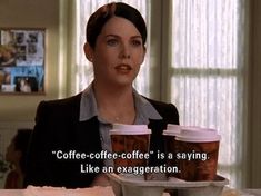 a woman sitting at a table with two cups of coffee in front of her and the words coffee - coffee coffee is a saying like an exegetion