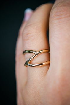 This beautiful ring will become a staple in your wardrobe! It is handcrafted out of a D-shaped (half round) metal. Two ends connect at the center of the ring create a branch-like design that will not move or change with time. This listing is for ONE single ring in 14K Gold Fill. This ring is whimsical, classic and infinitely stylish. Every piece is organic and unique — no two Hannah Naomi pieces are exactly alike.Hand-crafted to order in our Portland, OR studio. Gold Wrap Ring, Gold Stacking Ring, Criss Cross Ring, Woven Ring, Minimal Ring, Branch Ring, Single Ring, Bold Rings, Gold Wrap