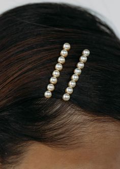 The Gracie Bobby Pins are a wardrobe staple. This set of two features rows of hand bezel-set Swarovski pearls, for a sweet yet sophisticated finishing touch. When it comes to bobby pins, more is more: don't be afraid to layer on multiple sets, or mix with the Gwen Bobby Pins and Perla Bobby Pins. Product Details Hand bezel-set Swarovski pearls. Steel bobby pins. Made in the USA. Care Instructions Store in dust bag. Avoid contact with water, perfume, and other chemicals, including hairspray, whic Pearl Bobby Pins Hairstyle, Pearl Hairstyles, Pearl Bobby Pins, Pearl Hair Accessories, Birthday Pics, Luxury Hair Accessories, Prom 2023, Bobby Pin Hairstyles, Water Perfume