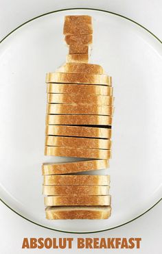 an advertisement for absolut breakfast with toasted bread stacked on top of each other