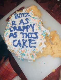 a cake with frosting and sprinkles that says boyz rasp as happy as the cake