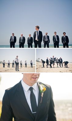 a man in a suit and tie is standing on the beach with other men wearing suits