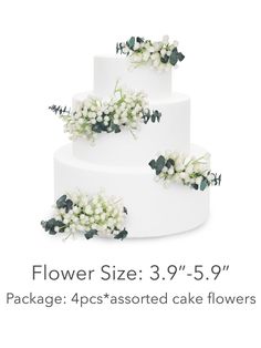 three tiered wedding cake with flowers on top