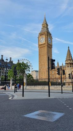 the big ben clock tower towering over the city of london on a clear blue day