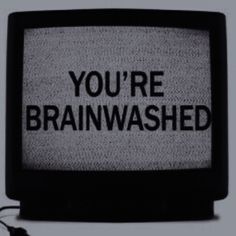 an old television with the words you're brainwashed on it in black and white