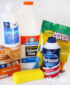 ingredients to make pancakes including milk, baking soda, butter and other items on a white surface