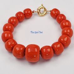 Thank you for coming in! Beautiful rare Mediterranean Sardinia Coral with stunning tomato red color and lovely barrel shape! The color is directly from the ocean, not dyed! 100% natural beauty! 7.8 inch bracelet with 15 huge coral barrels and 18k solid gold sailor clasp! Manufactured in Italy! Appr 48 Grams. You'll get the bracelet you see! SIZE of the coral : Appr.11mm-18.6mm Diameter COLOR: Red GRADE: AA Vintage Red Coral Round Bead Jewelry, Single Strand Round Red Coral Beads, Red Coral Round Beads Single Strand, Red Coral Spacer Beads, Round Shape, Multi-strand Red Coral Necklace With Polished Beads, Coral Beads, Sardinia, Red Coral, Red Color