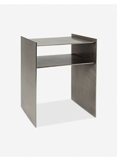 a metal desk with an open shelf on the top and one drawer at the bottom