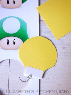 the paper mario mushroom is cut out to make it look like he's smiling