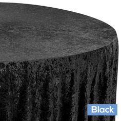 a round table with black velvet on top