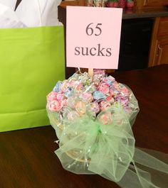 there is a bag with candy in it and a sign that says 65 sucks on it