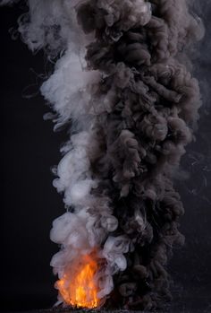 ☆ Artist  Kevin Cooleyゝ。Swirling and imposing clouds of smoke contend with one another in a physical battle between diametrically opposing explosions of Black and White. From a structuralist point of view, this imagery serves as metaphor for binary opposition, e.g. Good vs. Evil or Day vs. Night.。☆ Wild Photography, Dark Skies, Fire And Ice, Dark Souls, Dark Wallpaper, Visual Effects, American Artists, Colorful Art