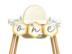 a white chair with wooden legs and some signs on it that spell out the word ohe