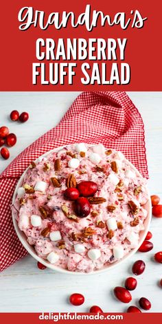 cranberry fluff salad with nuts and cherries on top