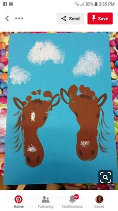 an image of two giraffes on a blue background with clouds in the sky