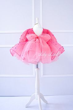 Looking for the perfect outfit for your little princess's special occasion? Look no further than our stunning Dress! Perfect for flower girls, birthdays, and other special occasions, this dress is sure to make your little girl feel like a true princess. Made with high-quality materials, this toddler dress is not only beautiful but also comfortable for your little one to wear. The soft and breathable fabric ensures that your baby girl will feel comfortable and happy all day long, whether she's po First Birthday Princess Dress With Bow, Princess Dress With Bow For First Birthday, Princess Style Dress With Bow For First Birthday, Pink Long Sleeve Princess Dress With Ruffles, Spring Pageant Princess Dress With Bow, Sweet Easter Party Dress, Sweet Easter Party Dresses, Cute Princess Dress With Bow For First Birthday, Princess Organza Tutu Dress For Party