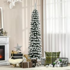 a decorated christmas tree in front of a fireplace