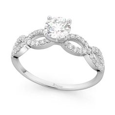 a white gold engagement ring with diamonds on it