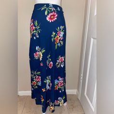 New W/ Tags - Ambience Apparel - Blue Floral Skirt - Size L Waist: 32” Please Note The Back Side Of Skirt Has An Elastic Waistband That Provides Stretches Skirt To 36” Length: Approximately 38” 100% Polyester Hand Wash Cold Non-stretch Multicolor Floral Print Skirt, High Waist Fitted Maxi Skirt For Vacation, Fitted High Waist Maxi Skirt For Vacation, Floral Print Non-stretch High Waist Skirt, Casual Fitted Flared Maxi Skirt, Blue Floral Print Long Skirt, Casual Non-stretch Floral Print Maxi Skirt, Casual Non-stretch Floral Maxi Skirt, Full Length Spring Vacation Skirt