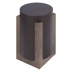 a black and grey table with a round top on it's side, in front of a white background