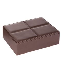 a brown leather box with four square sections