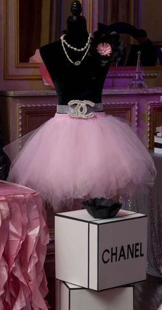 a mannequin dressed in a pink tutu skirt