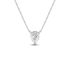 Add instant glamour to your daily wear with this pear solitaire necklace. The white gold pendant features a stylized three-prong basket securing pear-cut diamond that points downwards. This necklace delivers a subtle sparkle that can go from office to evening wear with ease. Solitaire Necklace, White Gold Pendant, Pear Cut Diamond, Solitaire Necklaces, Lab Created Diamonds, Pear Cut, Evening Wear, Gold Pendant, The White