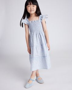 Cottagecore, but make it kid-size. Our 100% Cotton Poplin Smocked Dress channels all those dreamy playtime moments into a charming tiered dress with sweet ruffle trim. Crafted in soft, breathable fabric with smocking for a flexible fit, it's a comfy yet carefree choice for playtime or dress-up days.  | Quince | Poplin Smocked Dress in Blue Ditsy Daisy, Size 12, Cotton Dress Up Day, Tea Parties, Smocked Dress, Dresses Kids Girl, Tier Skirt, Tiered Dress, Dress 100, Quince, Ruffle Trim