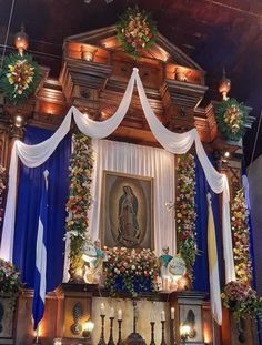 the altar is decorated with flowers and candles