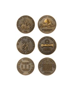 four bronze coins with different designs on them