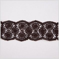 the lace is brown and white with flowers on it's side, as well as black trim