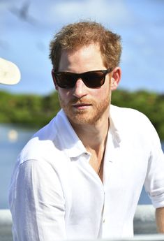 a man wearing sunglasses and a white shirt