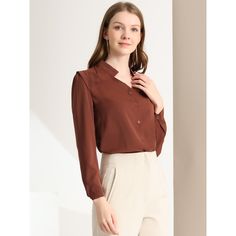 This shirt is elegant and charming for workwear or a day-to-night look, with a cut-out v-neck and unique shoulder details. No-see-through chiffon fabric and stylish v-neck make it a perfect choice for work, office, and daily wear. Pair this work office shirt with a pencil skirt, work pants, or casual jeans. The return of a classic, this button-up shirt is cut from in a chiffon sateen in an always flattering fit-and-flare silhouette. Model Body Size: Height: 5'9", Chest: 33 inches, Waist: 24 inch Elegant Brown V-neck Blouse, Brown Lapel Collar Top For Work, Elegant Brown Business Tops, Elegant Brown Business Top, Classic Brown Blouse For Work, Classic Brown Blouse For Office, Classic Brown Office Blouse, Elegant Brown Collared Blouse, Semi-formal Fall V-neck Top