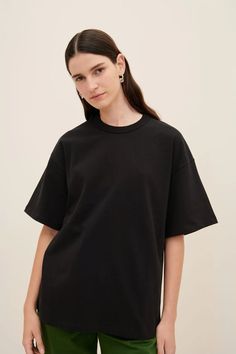 The Symmetry Tee is an oversized style with dropped shoulders and a classic crew neckline, made from heavyweight organic cotton jersey. All Fairtrade organic cotton. All plastic-free. Sizing: Designed for an oversized fit, we recommend to size down one to two sizes for a closer fit. Kowtow's model is wearing a size XS. Model's measurements:- Height: 177.8 cm / 5'10"- Waist: 61cm / 24"- Hips: 89cm / 35" Knitwear Dress, Business People, Oversized Style, Scarf Jewelry, Mens Accessories Fashion, Shirt Skirt, Skirts For Sale, Plastic Free, Black Tee