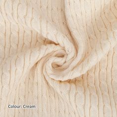 an image of a white knitted fabric with the word colour cream on it