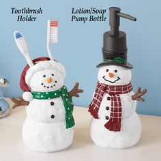 two snowmen are standing next to each other with toothbrush holders on their heads