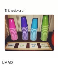 some cups are stacked on top of each other in front of a door with the words, this is clever af