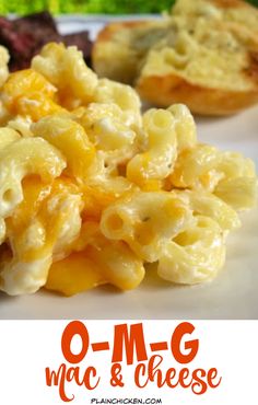 macaroni and cheese on a white plate with broccoli in the background