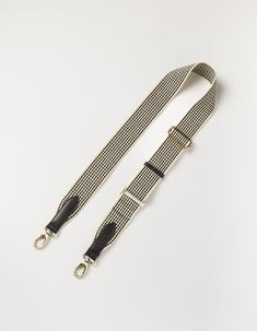 Freshen up your favorite bag by swapping out the strap for our Black and White Checkered Webbing Strap. The brass-colored clasps combined with black and white webbing make this strap a timeless but edgy alternative for every other strap you have. Personalize your O My Bag and make it last even longer. All O My Bags with a detachable strap design can be styled with the Checkered webbing strap. Give your outfit just that little bit extra. OMB-CHECKEREDBLACKSTRAP Classic Adjustable Bag Strap, Adjustable Black Leather Shoulder Strap, Adjustable Black Shoulder Strap, Adjustable Black Shoulder Strap For Everyday, Classic Black Bag Strap For Everyday Use, Adjustable Black Casual Bag Strap, Casual Adjustable Black Bag Strap, Black Leather Bag Strap For Fashion Accessories, Black Leather Bag Strap Fashion Accessory