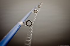 three different types of metal objects on a table with blue and silver wires attached to them