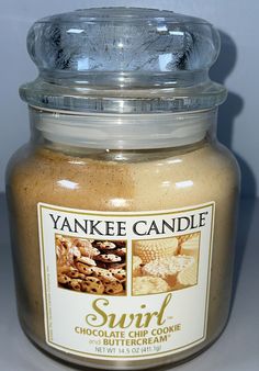 a jar of yankee candle is shown with the lid open to show it's chocolate chip cookie flavor