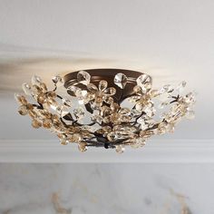 a chandelier hanging from the ceiling in a room